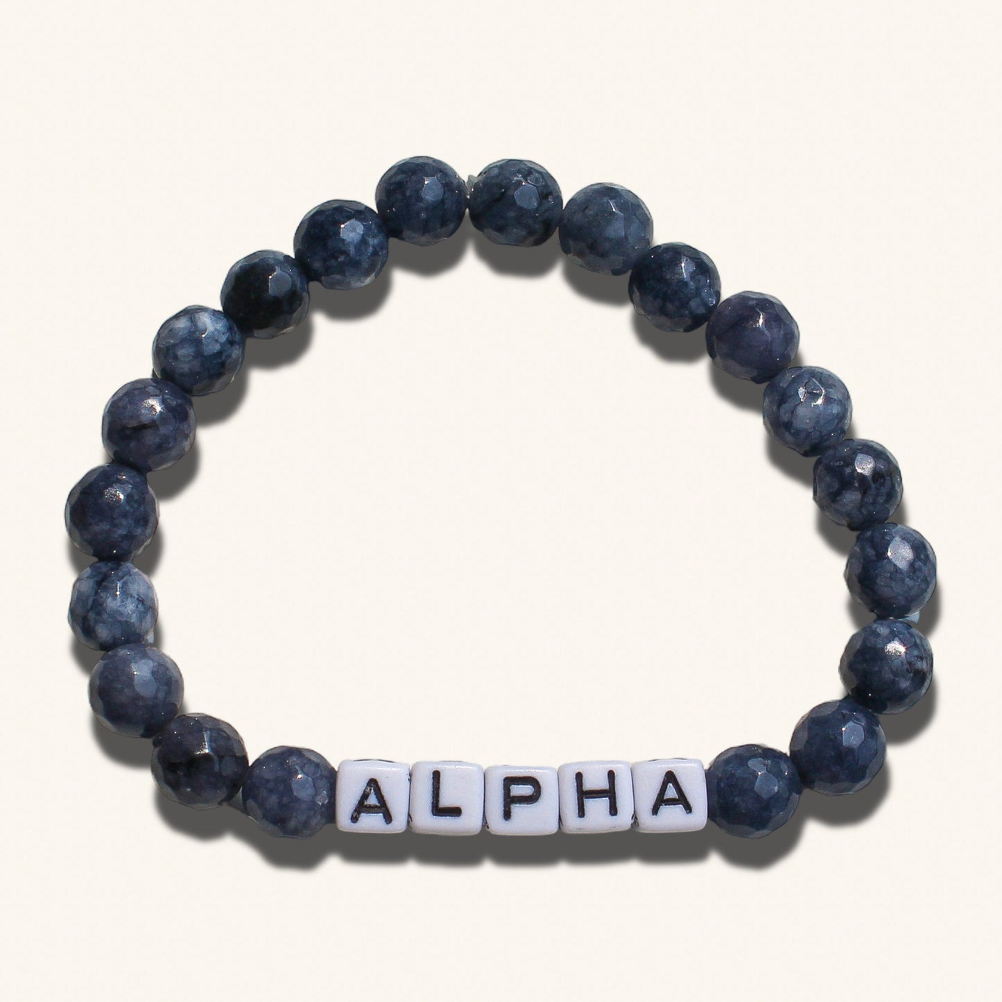 Alpha men’s bracelet with dark beaded design representing bold masculine energy and dominance.