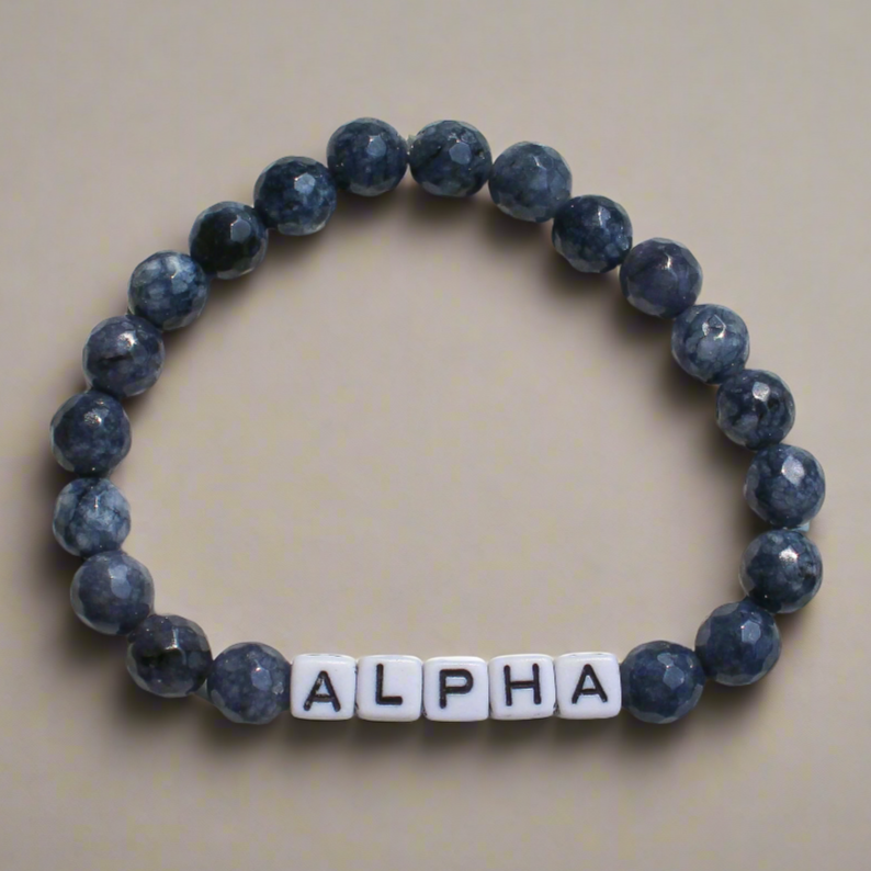 Alpha men’s bracelet with dark beaded design representing bold masculine energy and dominance.
