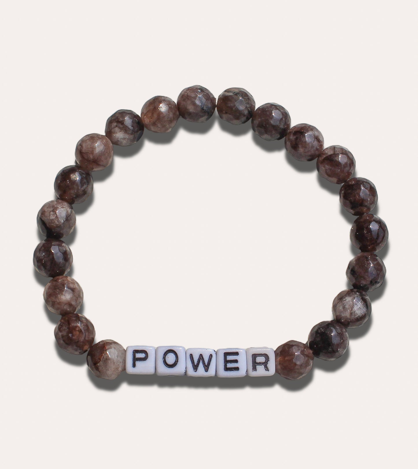 Bold men’s beaded bracelet symbolizing power and confidence, customizable with your word.