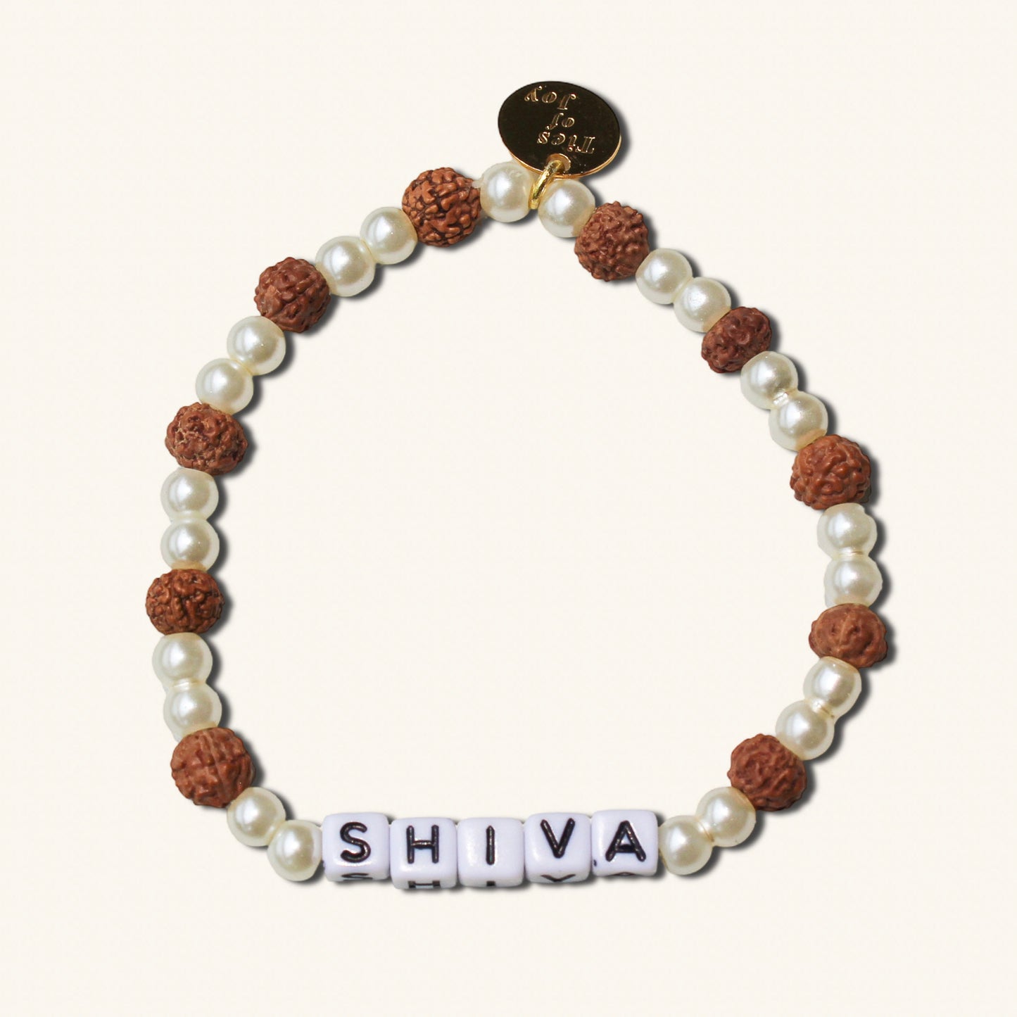 Bracelet with pearls and brown beads spelling 'SHIVA' on a white background