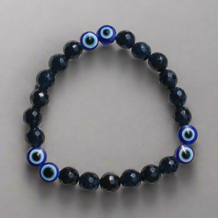 Handmade evil eye beaded bracelet for men in black and blue tones for protection and style.
