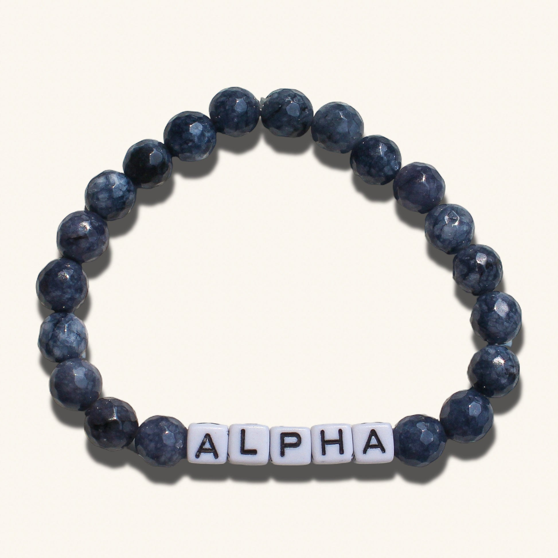 Alpha men’s bracelet with dark beaded design representing bold masculine energy and dominance.