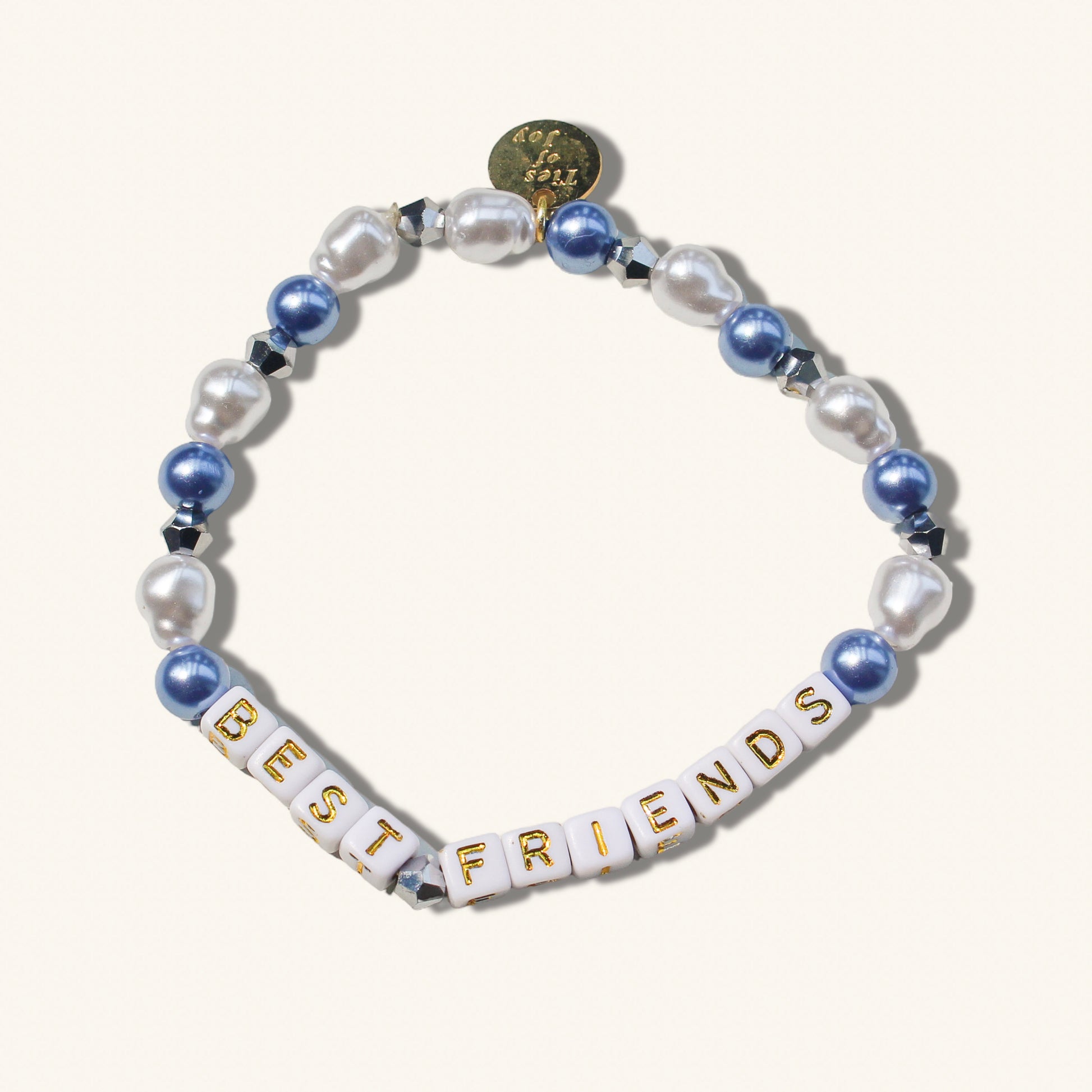 Bracelet with 'BEST FRIENDS' beads on a white background