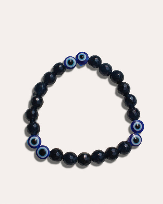 Handmade evil eye beaded bracelet for men in black and blue tones for protection and style.