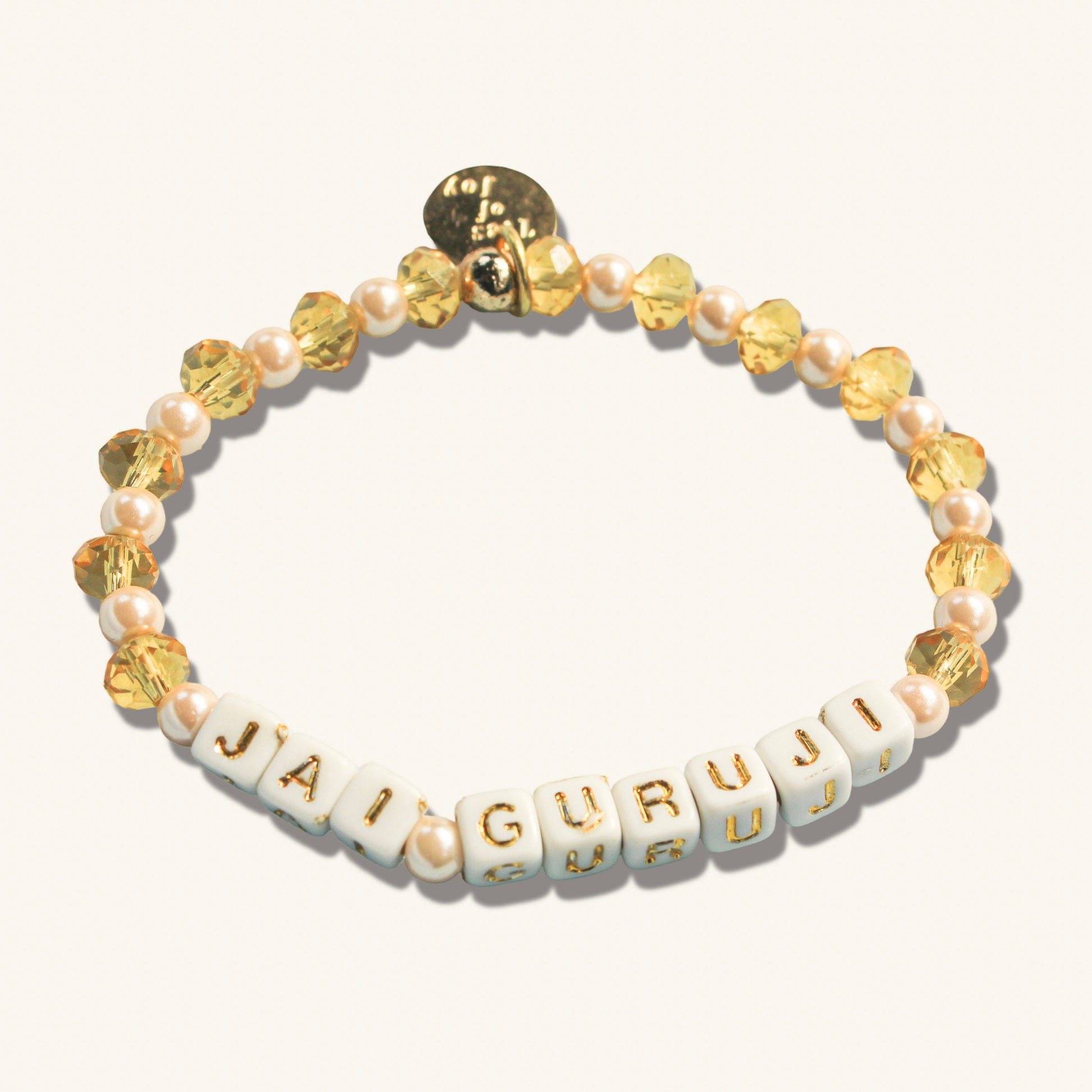Jai Guru Ji – Custom handmade beaded bracelet with personalized name or mantra. Perfect for gifting, self-expression, and meaningful everyday wear.