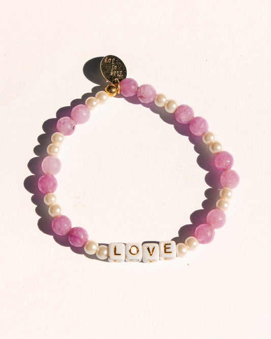 Love – Custom handmade beaded bracelet with personalized name or mantra. Perfect for gifting, self-expression, and meaningful everyday wear.
