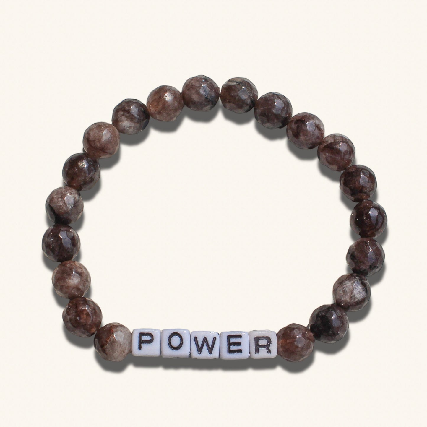 Bold men’s beaded bracelet symbolizing power and confidence, customizable with your word.
