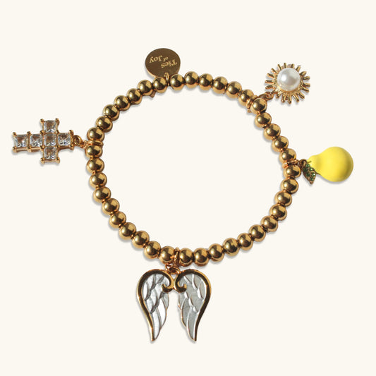 Gold beaded bracelet with cross, angel wings, sun, and pear charms