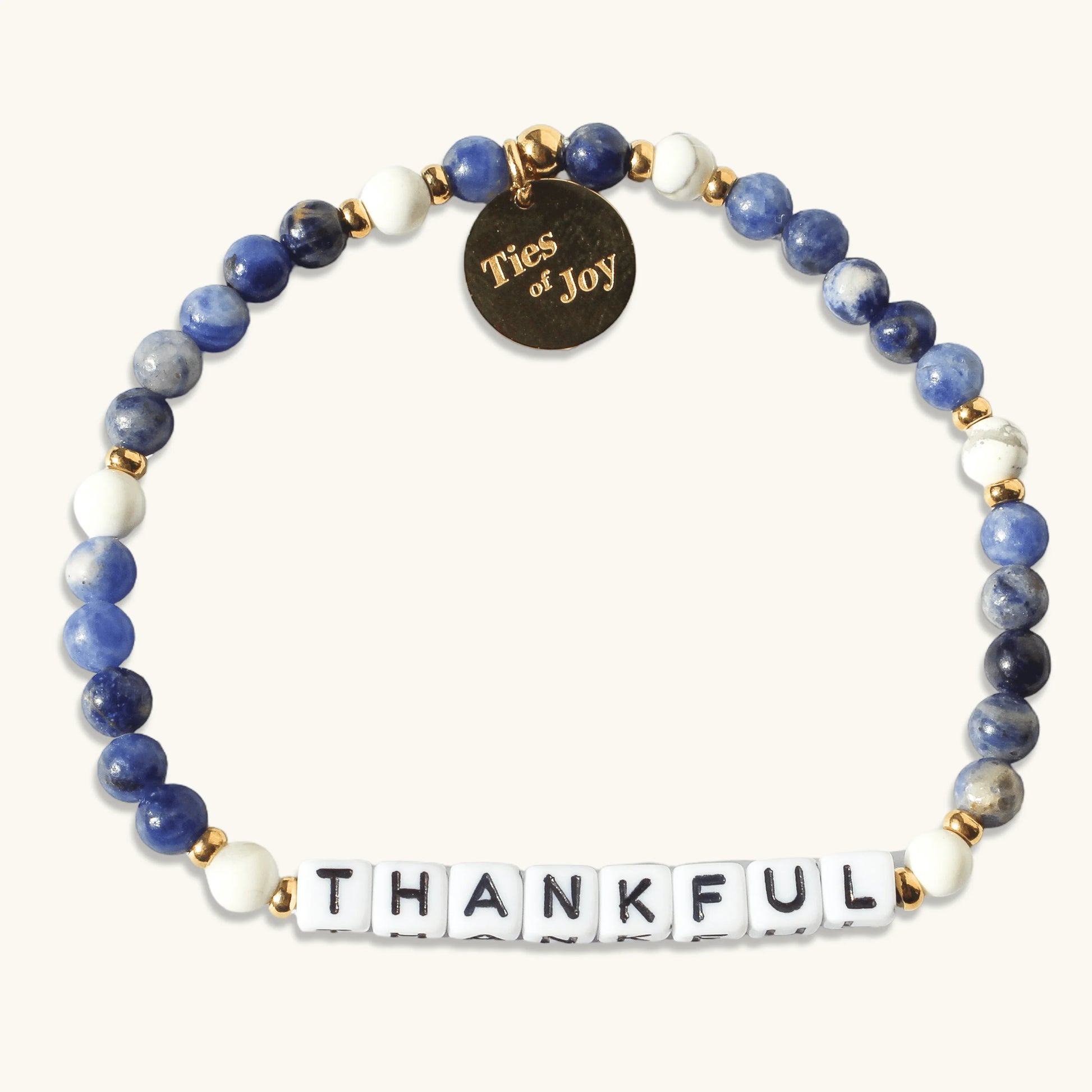 Ties of Joy blue beaded bracelet with THANKFUL letter beads and gold accents