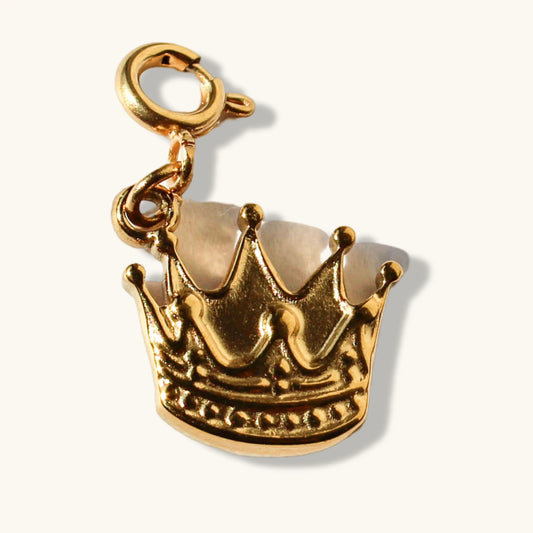 Gold crown charm with lobster clasp on a light background