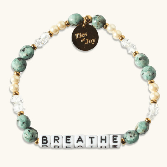 Beaded bracelet with green stones, pearls, 'BREATHE' letter beads, and Ties of Joy gold charm