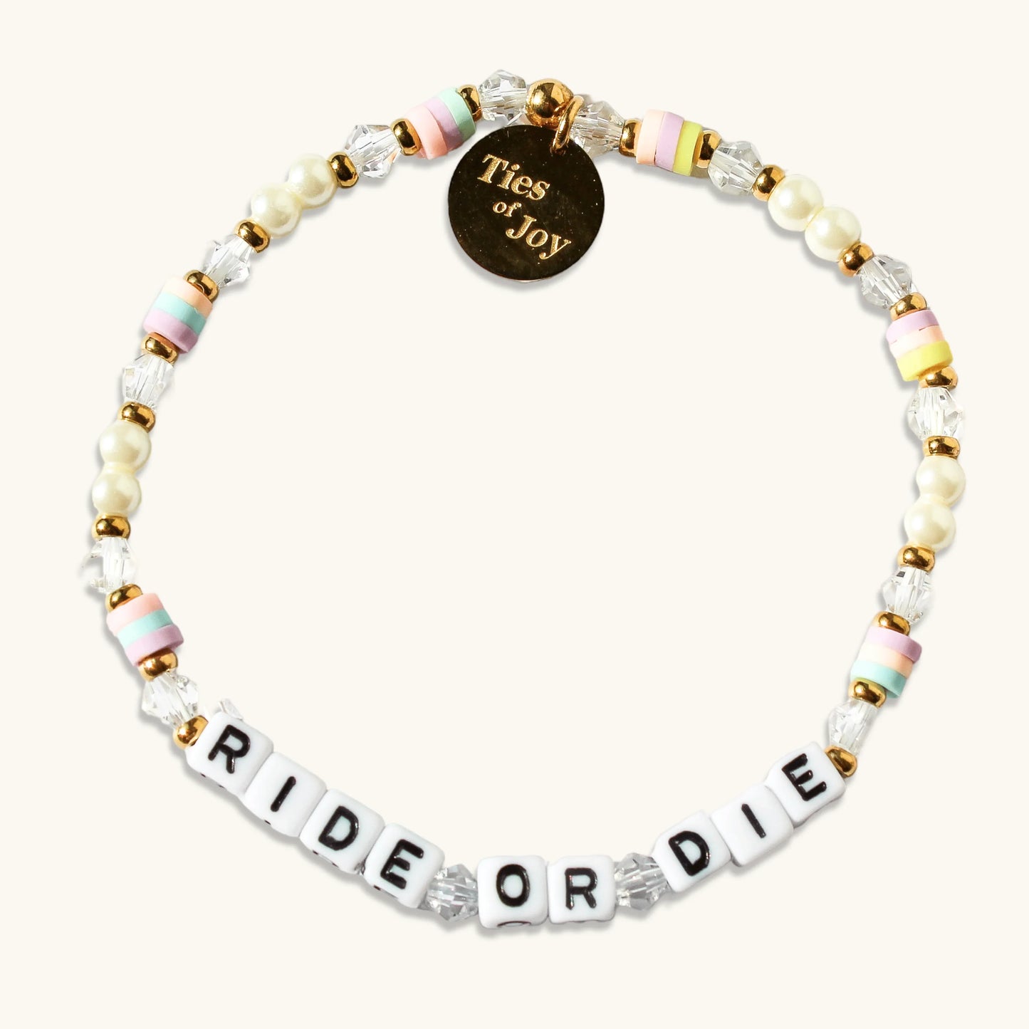 Beaded bracelet with pastel beads, gold accents, Ties of Joy charm, and 'RIDE OR DIE' letters