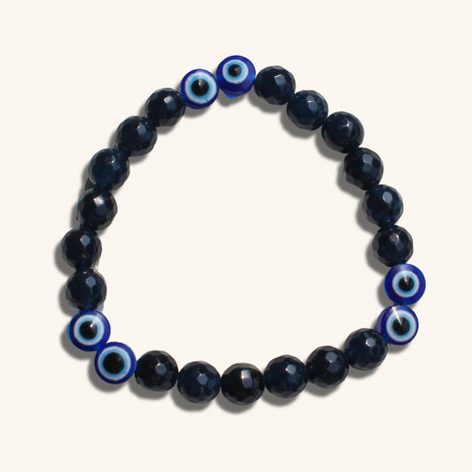 Handmade evil eye beaded bracelet for men in black and blue tones for protection and style.