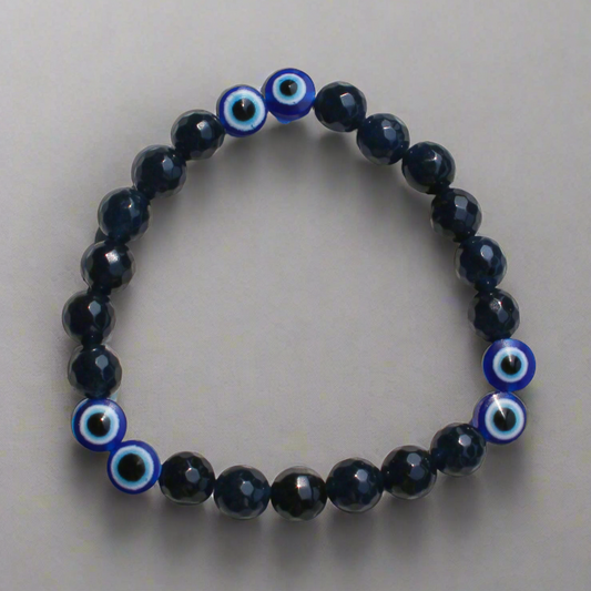 Handmade evil eye beaded bracelet for men in black and blue tones for protection and style.